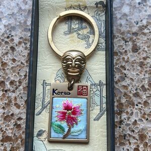 Gold Tone Korean Mask Keychain with Flower 🌺 Tag In Box 🗃️ engraved Korea back